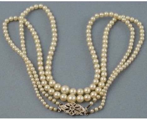 A pearl necklace, comprising a double strand of graduated beads having 9ct white gold clasp set with diamonds, 44cm long