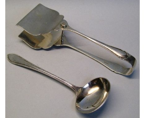 A pair of cake tongs, Crescent pattern, 19.5cm long, Sheffield 1933 and a Garrard and Co sauce ladle with beaded edge, 18cm l
