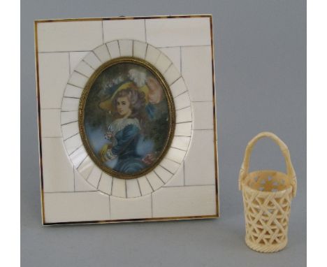 A French oval miniature, half length portrait of a Gainsborough style lady in piano ivory easel frame, 8cm high and a carved 
