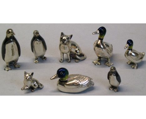 A graduated set of three 925 silver and niello miniature figures of penguins, largest 4cm high, three 925 silver and enamel m