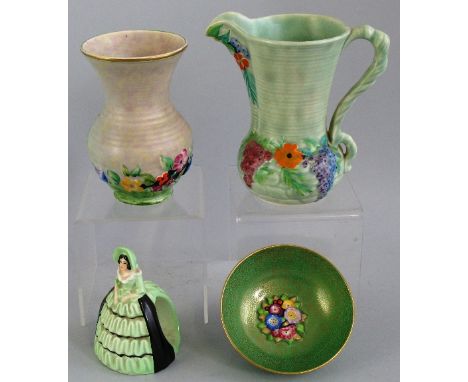 A Carlton Ware napkin ring, in the form of a green and black glazed crinoline lady, 10cm high, a Carlton Ware jug of ribbed f