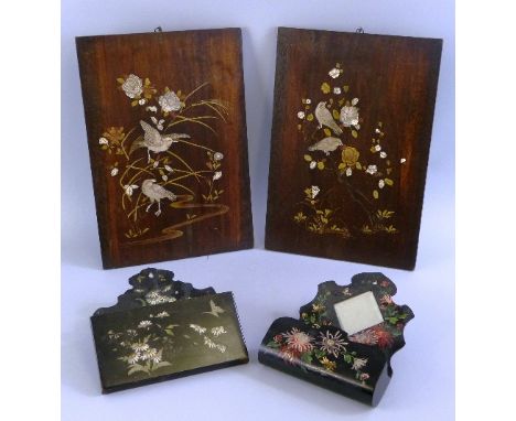 A pair of Japanese hardwood and shibayama panels, each of oblong form inlaid with bone, ivory and mother of pearl with studie