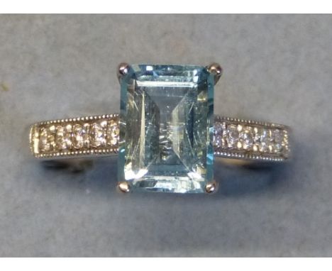 An aquamarine and diamond ring, comprising central claw set oblong aquamarine (1.75ct) on 18ct white gold shank with diamond 