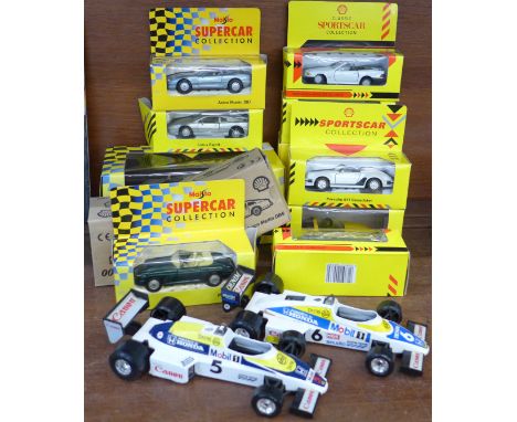 Thirteen die-cast model vehicles including Maisto and two Formula 1 racing cars