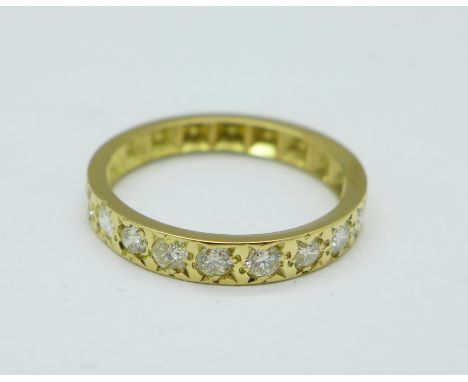 A yellow metal and diamond half eternity ring, set with ten diamonds, 2.4g, L