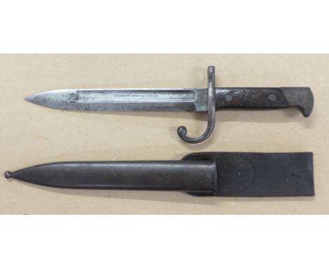 A bayonet with scabbard, the blade marked Remington Arms Co. Ilion. N.Y., with scabbard