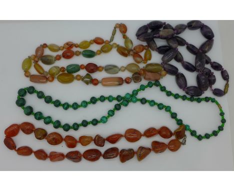Four gem set necklaces including amethyst and malachite