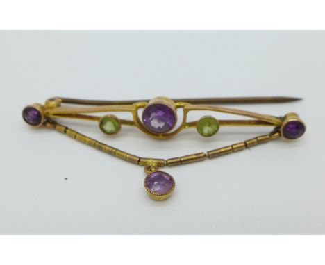 A 9ct gold, amethyst and peridot brooch, 2.4g, lacking fastening hook