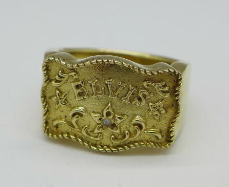 A silver gilt 'Elvis' ring set with a small diamond, W