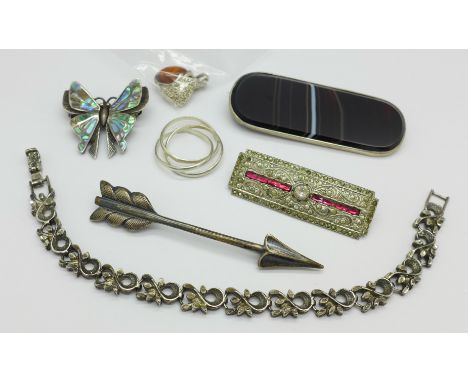 A silver arrow brooch, a large agate brooch, a silver and abalone butterfly brooch, etc.