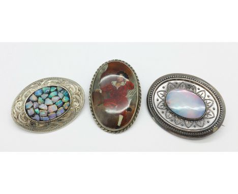 Three brooches including two set with opal