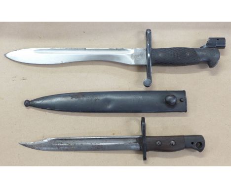 A Spanish bayonet, the blade marked Toledo and 3347, Y, with scabbard, and one other bayonet, (2)