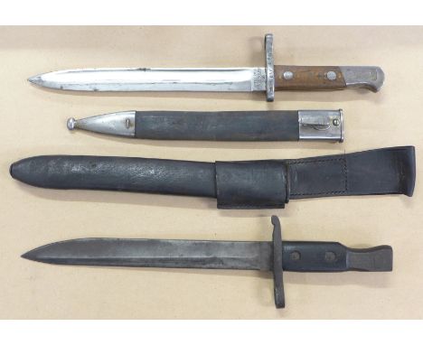 A Spanish bayonet and scabbard, marked Artilleria Fca de Toledo 1895 and one other bayonet and scabbard