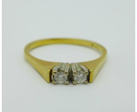 An 18ct gold and two stone diamond ring, 2.7g, L