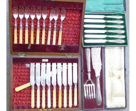 A set of six silver handled knives, a silver plated set of fish servers, a part set of nine pudding knives and forks with bon