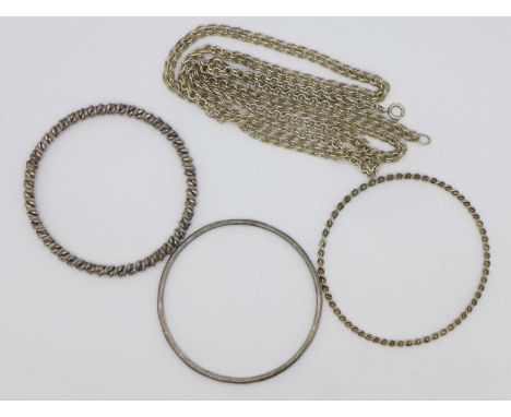 Three white metal bangles and a long white metal chain, all test as silver, 79.3g, (one bangle and the chain marked silver)