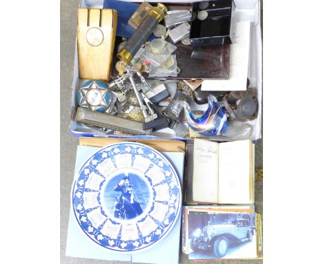 Assorted items; lighters, a Hohner harmonica, a telescope, postcards, etc.