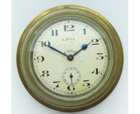 A Gilford 8-days car clock with bezel wind and time change