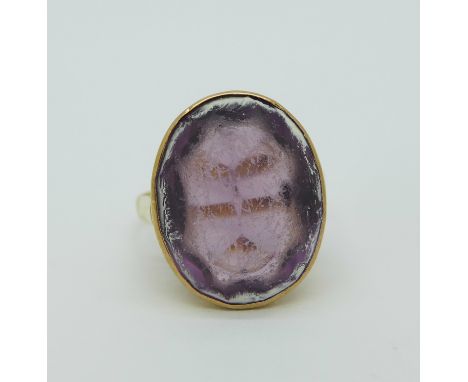 A yellow metal and amethyst ring, tests as 18ct gold, 5.4g, K, a/f