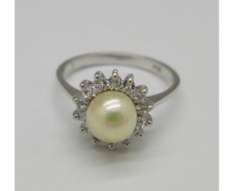 An 18ct white gold, pearl and white stone ring, marked 750, 3.4g, O