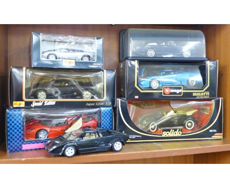 Seven large die-cast model vehicles including Bugatti, Rolls Royce and Ferrari F40, six boxed