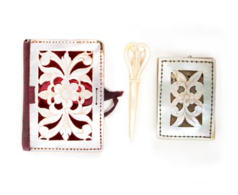 A mixed lot sewing comprising a rectangular mother of pearl pin cushion, each side pierced with a flowerhead and leaves, 5.5 