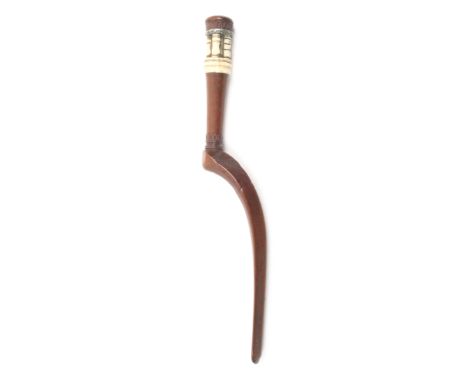 An unusual mahogany and bone knitting stick, probably French, curved triangular section blade with chip carved decoration, th