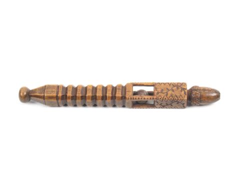 An early 19th Century fruitwood knitting stick, probably Welsh, of square section with ball terminal, the segmented stem belo