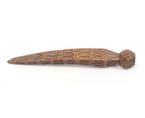 A dated 18th Century fruitwood knitting stick probably Durham, of slightly curved form with geometric chip carved decoration,