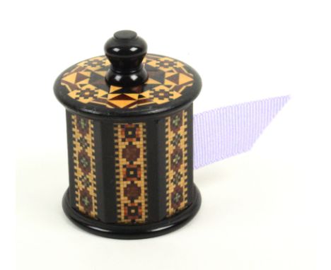 A Tunbridge ware ebony ribbon case, probably by Thomas Barton, the octagonal body with panels of mosaic below a mosaic and st