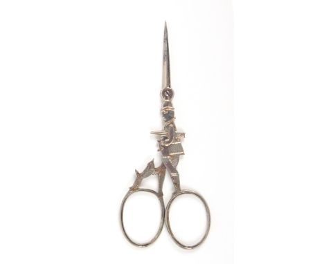 A rare pair of 19th Century plated steel scissors, the closed arms forming an image of a sporting gentleman with gun and bowl