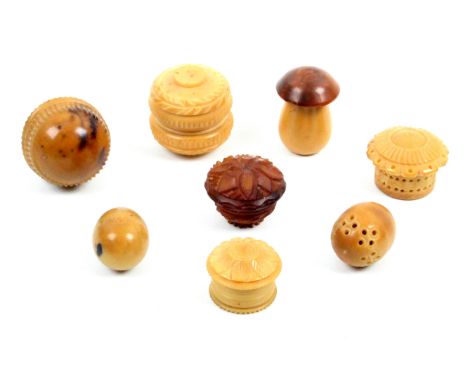 Eight vegetable ivory small boxes and pomanders some with engine turned decoration, including a mushroom form example, larges