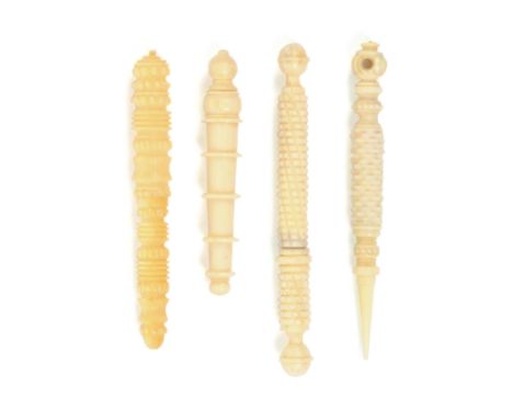 Three 19th Century ivory needlecases and a stiletto, comprising two cylinder form examples with engine turned decoration, ano