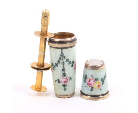 A pretty silver gilt and enamel thimble compendium, the green ground with garlands of flowers, the screw off thimble with sto