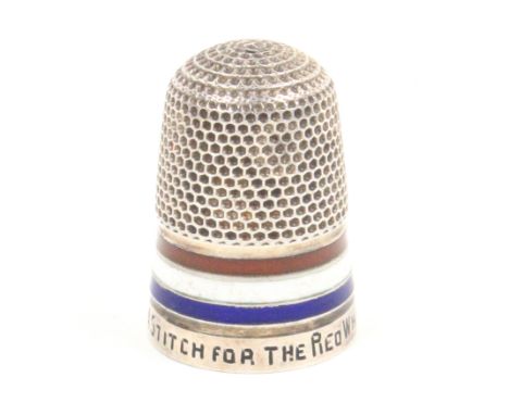 A silver thimble with red white and blue enamel frieze the rim inscribed ïA Stitch For The Red, White and BlueÍ, as usual the