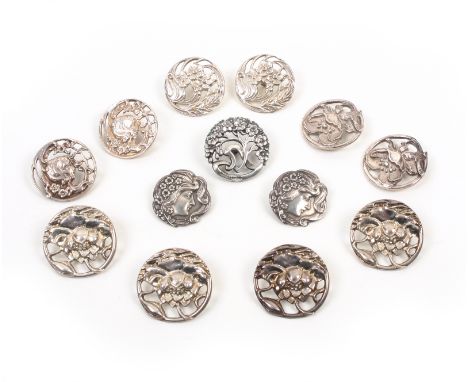 Silver buttons comprising a set of four floral cast and pierced examples, Birmingham, 1900 by L and S , 2.8cm, a floral cast 