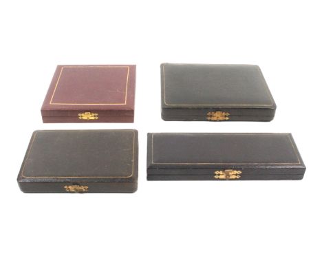 Four late 19th Century small format sewing companions all of rectangular form covered in leather or leatherette, all with a s
