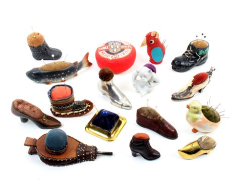 A collection of larger format pin cushions, nine in the form of shoes in various materials, largest 10cm, three ceramic examp