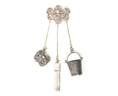 A small composite Chatelaine with three accessories, the pin mount pierced and cast with cherub head, leaves and scrolls with