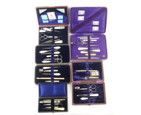 Five late 19th Century small format sewing companions all of rectangular form in leather or leatherette, all with a selection
