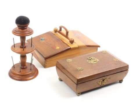 A Regency leather sewing box, another box and a reel stand, the Regency box in brown leather with basket of fruit gilt ring l