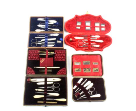 Four late 19th Century small format sewing companions comprising a red plush example of shaped outline, 23.5cm, and three rec