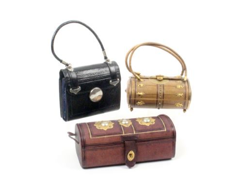 Three late 19th Century small format sewing companions comprising a dome top maroon leather example with three gilt lid plaqu