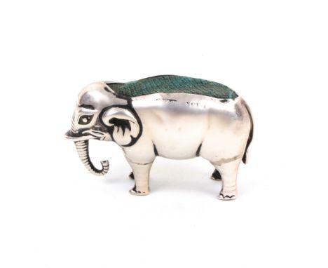 A silver pin cushion in the form of a standing elephant, marks rubbed, 6cm                                 (From the collecti