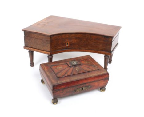 A mid 19th Century French rosewood sewing box in the form of a grand piano with inlaid keyboard on five turned tapering legs,