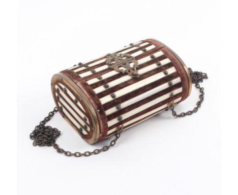 A late 19th Century sewing companion for a child of oval section in brown velvet with brass mounts, bone slats, brass catch a