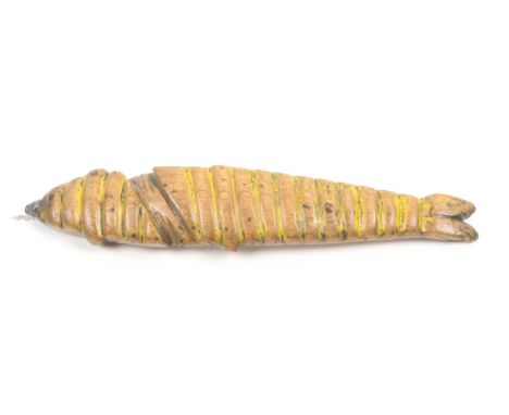 A 19th Century fruitwood knitting stick, slightly curved, in the form of a fish with grooved decoration, metal aperture, trac