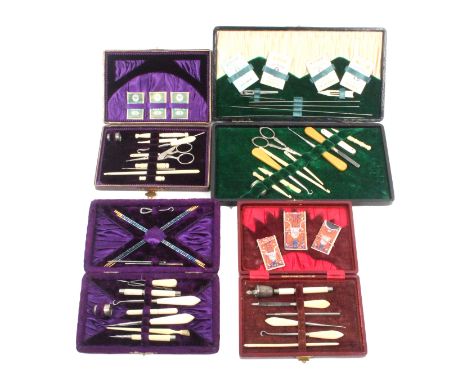 Four late 19th Century small format sewing companions, all of rectangular form, one in purple plush, three in leather, all wi
