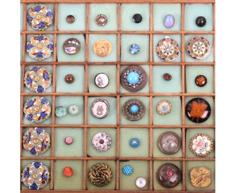 A collection of thirty nine buttons, mostly early 20th Century including a set of six pierced and decorated in coloured ename