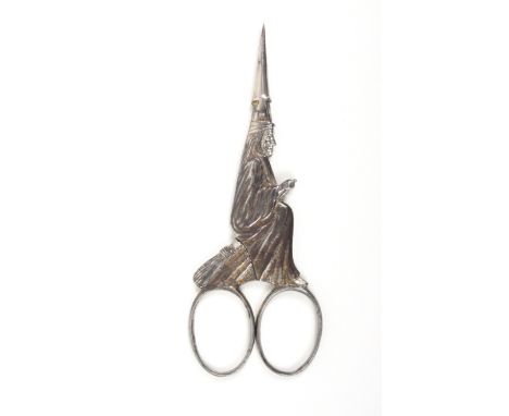 A pair of early 20th Century German steel and partly gilded scissors the arms in the form of The Salem Witch, oval loops, the